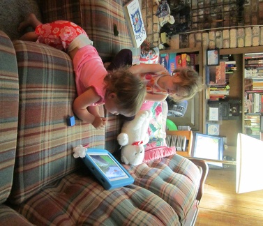 Greta and Olivia watching the iPad